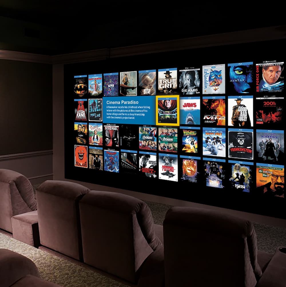 Home theatre room, showing various on demand movie options on the screen.