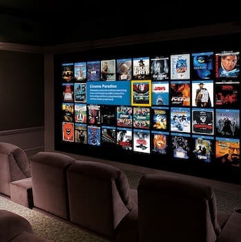 Home theatre room, showing various on demand movie options on the screen.