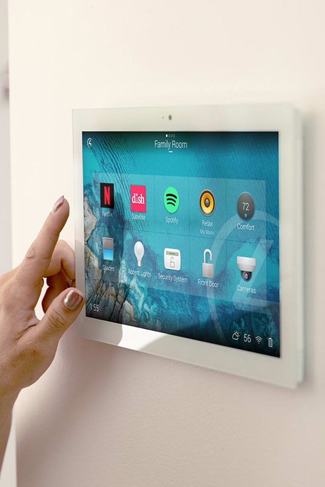 This image shows someone using an app on their ipad to control their home theatre system.